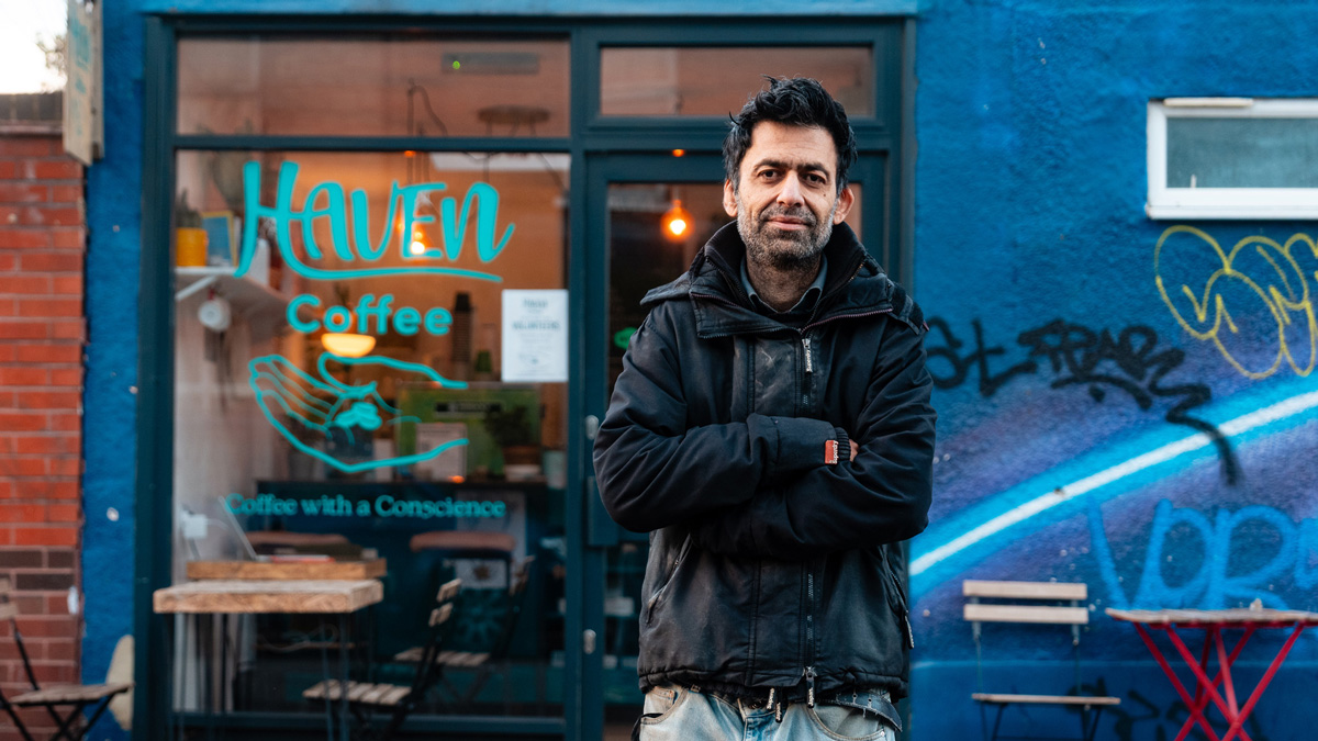 Usman Khalid, founder of Haven Coffee, standing outside his coffee shop